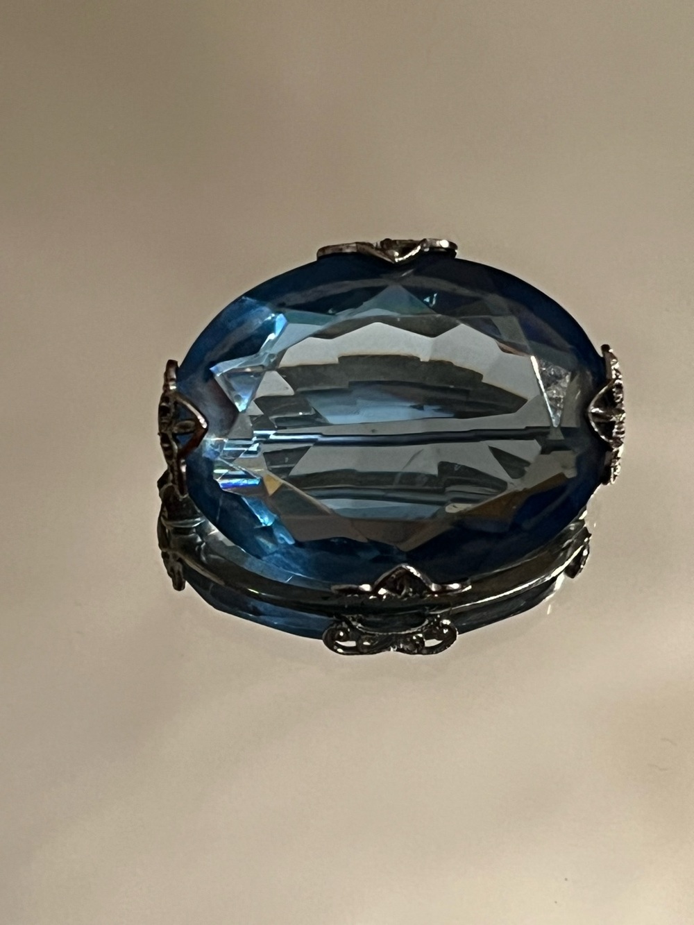 Antique faceted large oval blue glass pin brooch in silver tone filigree setting